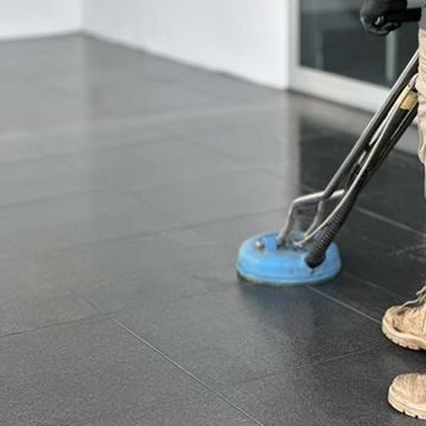 Scrubbing dark floor tiles